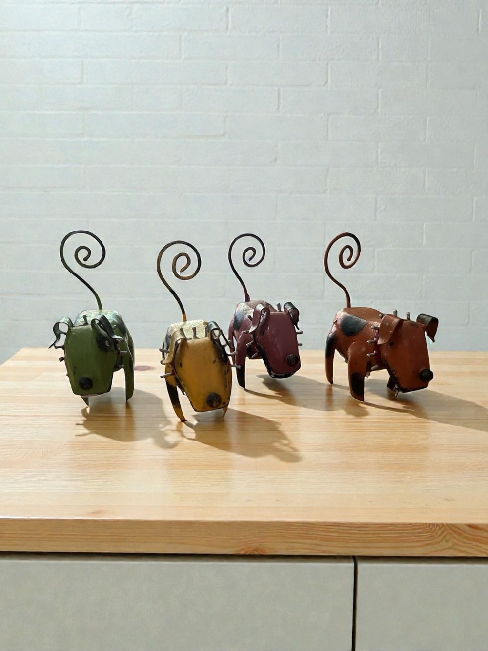 whimsical figurines are Spike Jr. metal dog sculptures set of 4